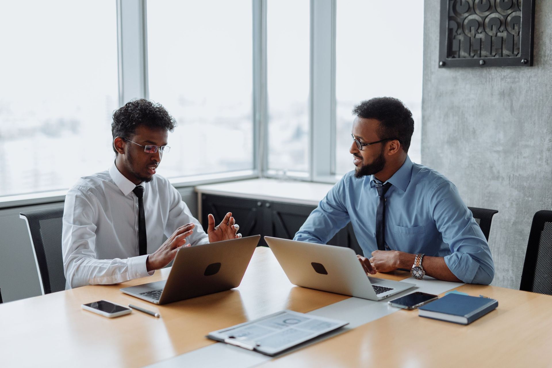 Two Cyrustic managers reviewing a client security plan.