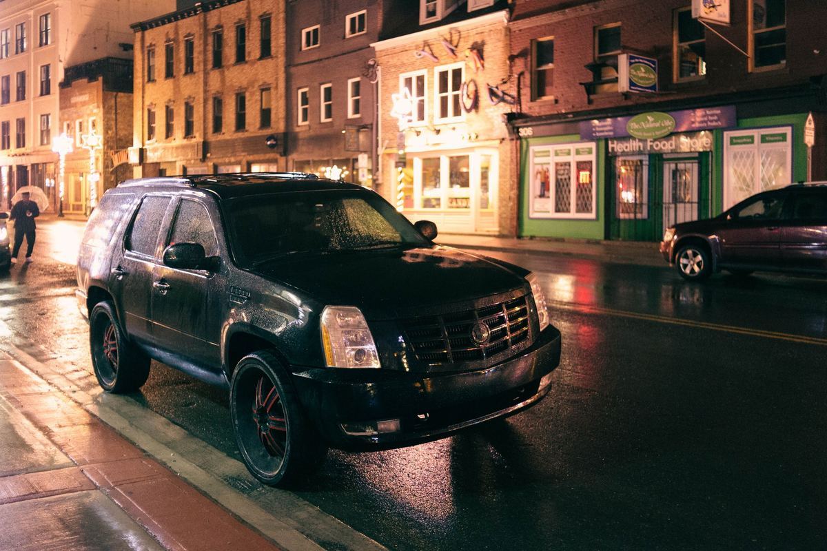 An armoured cash-in-transit vehicle on a city street.