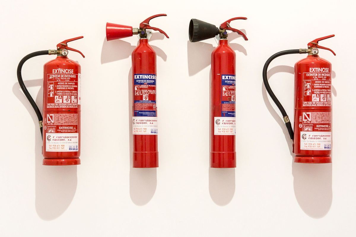 A row of serviced fire extinguishers.